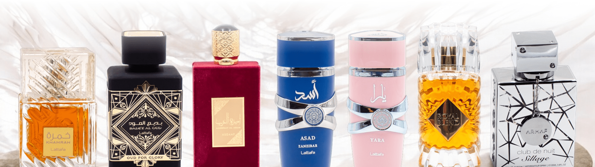 Pack de perfumes árabes directos de fábrica, con frascos de Lattafa y Armaf en diferentes diseños y colores sobre fondo elegante.